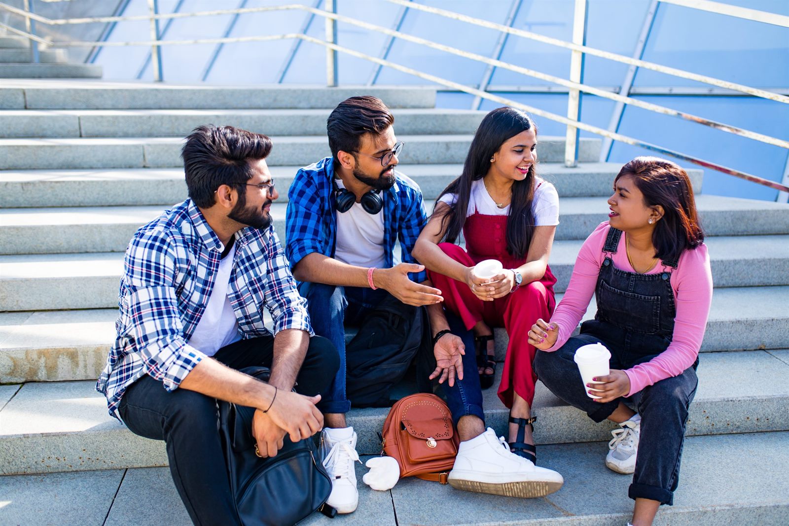 Students talking together on outdoor steps